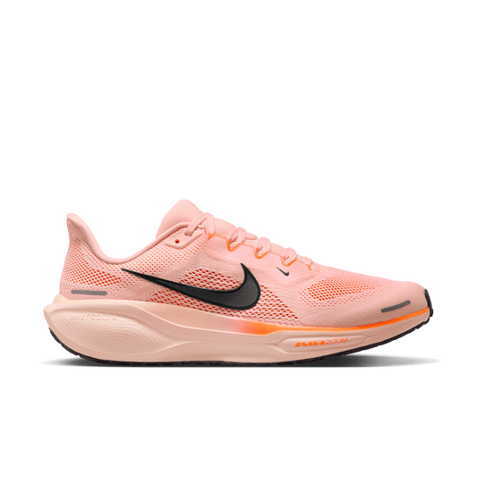 Pink running shoe with black Nike logo on a dark gray background