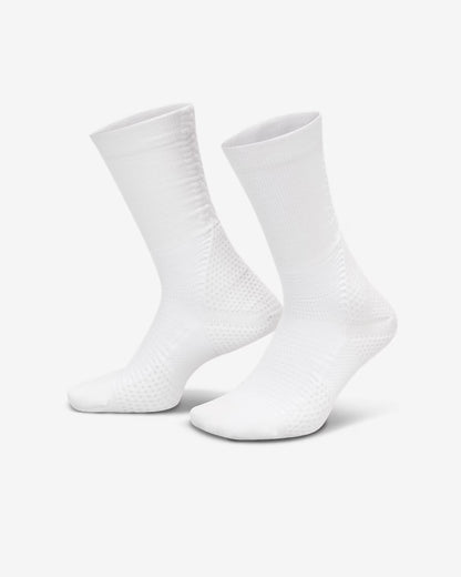Two white socks on a light gray background